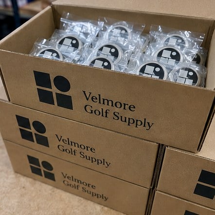 Customized golf ball markers for pro shops and retail